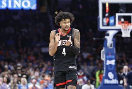 Mar 27, 2024; Oklahoma City, Oklahoma, USA; Houston Rockets guard Jalen Green (4) celebrates during a time out against the Oklahoma City Thunder in the second half at Paycom Center. Mandatory Credit: Alonzo Adams-USA TODAY Sports