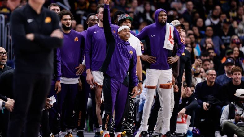 Mar 27, 2024; Denver, Colorado, USA; Phoenix Suns guard Isaiah Thomas (4) gestures from the bench in the fourth quarter against the Denver Nuggets at Ball Arena. Mandatory Credit: Isaiah J. Downing-USA TODAY Sports