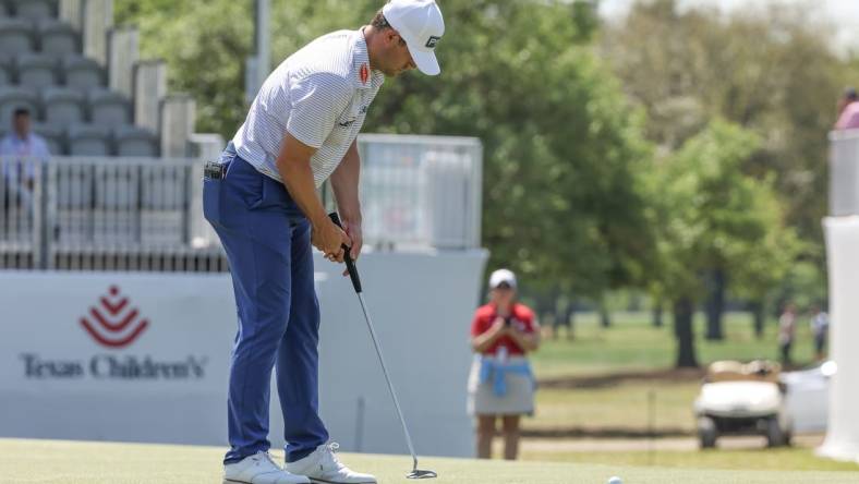 Mar 28, 2024; Houston, Texas, USA; Taylor Moore (USA) sinks his putt on the 18th green during the first round of the Texas Children's Houston Open golf tournament. Mandatory Credit: Thomas Shea-USA TODAY Sports