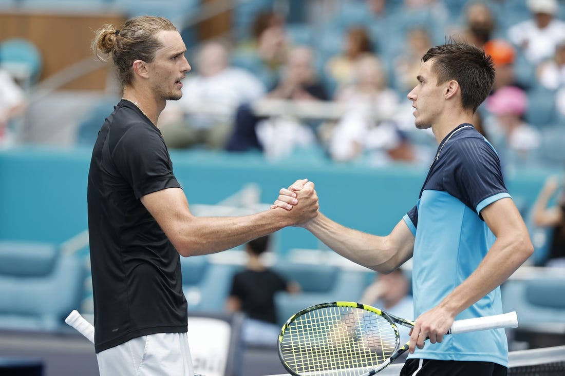 Mar 28, 2024; Miami Gardens, FL, USA; Alexander Zverev (GER) (L) shakes hands with Fabian Marozsan (HUN) (R) after their match on day eleven of the Miami Open at Hard Rock Stadium. Mandatory Credit: Geoff Burke-USA TODAY Sports