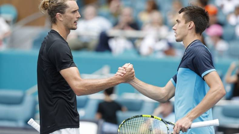 Mar 28, 2024; Miami Gardens, FL, USA; Alexander Zverev (GER) (L) shakes hands with Fabian Marozsan (HUN) (R) after their match on day eleven of the Miami Open at Hard Rock Stadium. Mandatory Credit: Geoff Burke-USA TODAY Sports