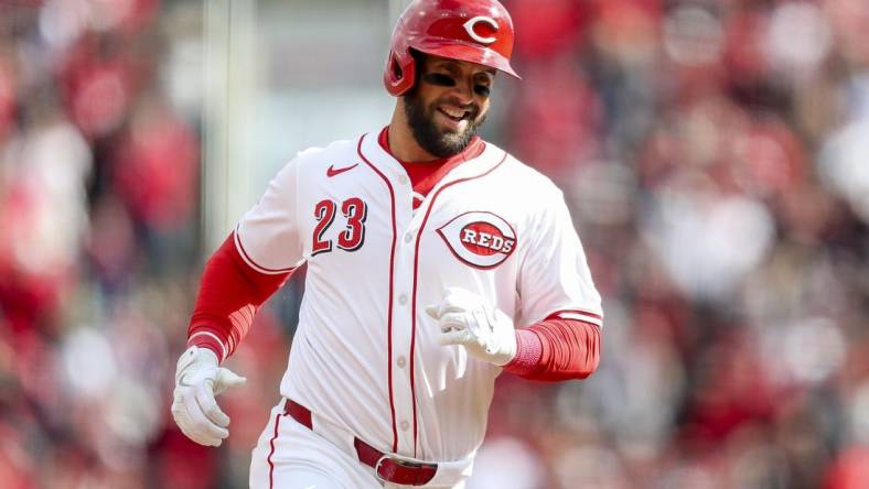 Mar 28, 2024; Cincinnati, Ohio, USA; Cincinnati Reds designated hitter Nick Martini (23) runs the bases after hitting a two-run home run in the second inning against the Washington Nationals at Great American Ball Park. Mandatory Credit: Katie Stratman-USA TODAY Sports