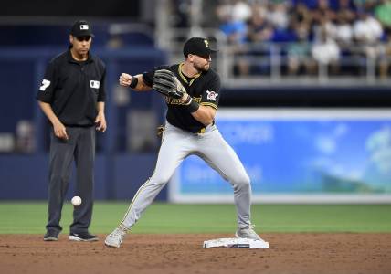 Mar 28, 2024; Miami, Florida, USA;  Pittsburgh Pirates second baseman Jared Triolo drops the ball while trying to turn a double play during the second inning against the Miami Marlins, at loanDepot Park. Mandatory Credit: Michael Laughlin-USA TODAY Sports