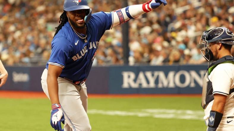 Mar 28, 2024; St. Petersburg, Florida, USA;Toronto Blue Jays first baseman Vladimir Guerrero Jr. (27) celebrates after he this a home run during the sixth inning against the Tampa Bay Rays  at Tropicana Field. Mandatory Credit: Kim Klement Neitzel-USA TODAY Sports