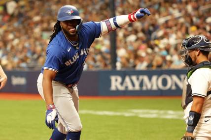 Mar 28, 2024; St. Petersburg, Florida, USA;Toronto Blue Jays first baseman Vladimir Guerrero Jr. (27) celebrates after he this a home run during the sixth inning against the Tampa Bay Rays  at Tropicana Field. Mandatory Credit: Kim Klement Neitzel-USA TODAY Sports