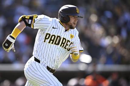 Mar 28, 2024; San Diego, California, USA; San Diego Padres first baseman Jake Cronenworth (9) watches his two-RBI double against the San Francisco Giants during the seventh inning at Petco Park. Mandatory Credit: Orlando Ramirez-USA TODAY Sports
