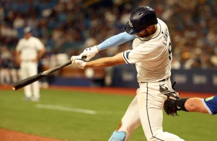 Mar 28, 2024; St. Petersburg, Florida, USA; Tampa Bay Rays first baseman Yandy Diaz (2) singles during the eighth inning against the Toronto Blue Jays at Tropicana Field. Mandatory Credit: Kim Klement Neitzel-USA TODAY Sports