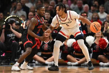 Mar 28, 2024; Boston, MA, USA; Connecticut Huskies guard Stephon Castle (5) dribbles the ball against San Diego State Aztecs guard Darrion Trammell (12) in the semifinals of the East Regional of the 2024 NCAA Tournament at TD Garden. Mandatory Credit: Brian Fluharty-USA TODAY Sports