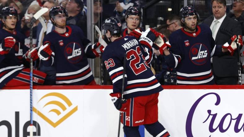 Mar 28, 2024; Winnipeg, Manitoba, CAN; Winnipeg Jets center Sean Monahan (23) celebrates his second period goal against the Vegas Golden Knights at Canada Life Centre. Mandatory Credit: James Carey Lauder-USA TODAY Sports