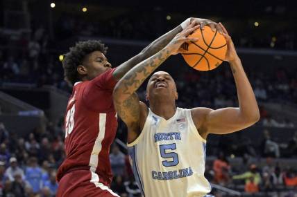 Mar 28, 2024; Los Angeles, CA, USA; Alabama Crimson Tide forward Nick Pringle (23) defends against North Carolina Tar Heels forward Armando Bacot (5) in the first half in the semifinals of the West Regional of the 2024 NCAA Tournament at Crypto.com Arena. Mandatory Credit: Jayne Kamin-Oncea-USA TODAY Sports
