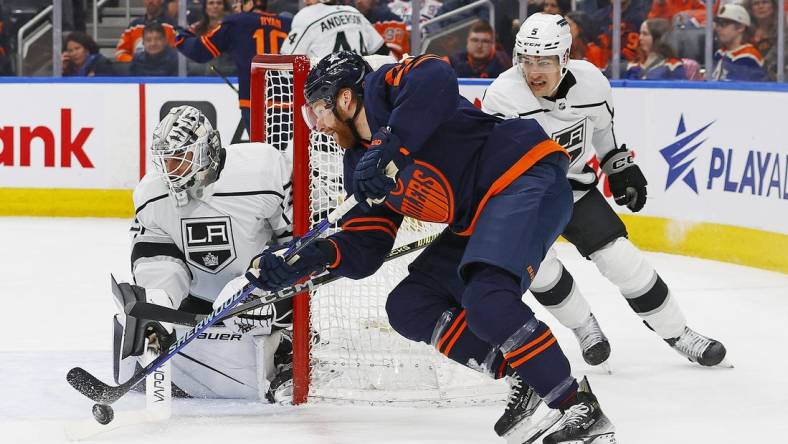 Mar 28, 2024; Edmonton, Alberta, CAN; Edmonton Oilers forward Connor Brown (28) tries to jam a puck past Los Angeles Kings goaltender Cam Talbot (39) during the first period at Rogers Place. Mandatory Credit: Perry Nelson-USA TODAY Sports