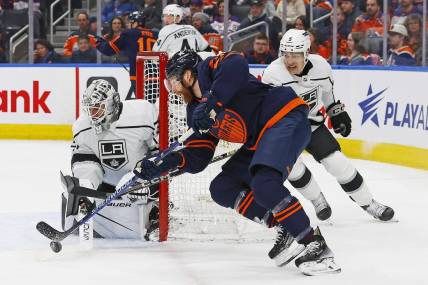 Mar 28, 2024; Edmonton, Alberta, CAN; Edmonton Oilers forward Connor Brown (28) tries to jam a puck past Los Angeles Kings goaltender Cam Talbot (39) during the first period at Rogers Place. Mandatory Credit: Perry Nelson-USA TODAY Sports