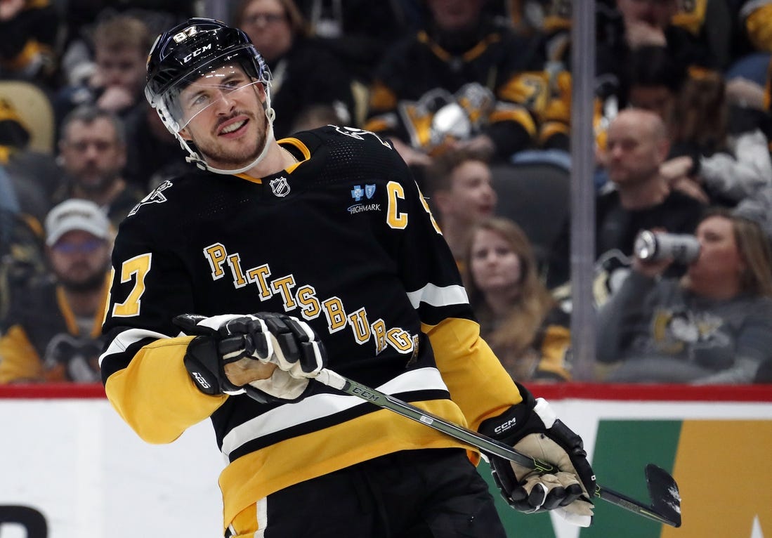 Mar 28, 2024; Pittsburgh, Pennsylvania, USA;  Pittsburgh Penguins center Sidney Crosby (87) reacts on the ice against the Columbus Blue Jackets during the third period at PPG Paints Arena. The Penguins won 3-2. Mandatory Credit: Charles LeClaire-USA TODAY Sports