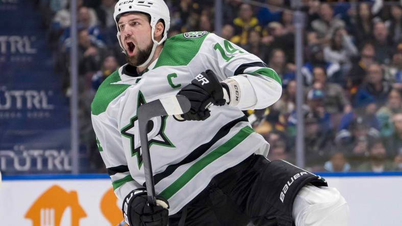 Mar 28, 2024; Vancouver, British Columbia, CAN; Dallas Stars forward Jamie Benn (14) celebrates his goal against the Vancouver Canucks in the third period at Rogers Arena. Dallas won 3 - 1. Mandatory Credit: Bob Frid-USA TODAY Sports