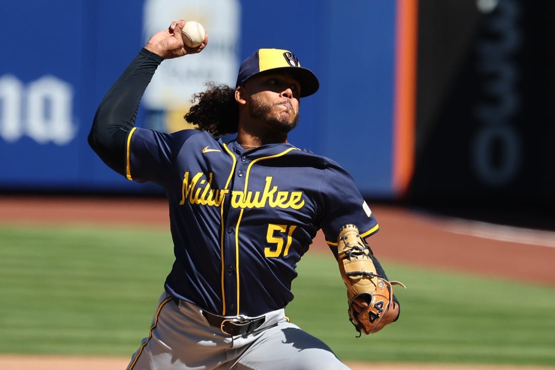 Mar 29, 2024; New York City, New York, USA; Milwaukee Brewers starting pitcher Freddy Peralta (51) delivers a pitch  during the first inning against the New York Mets at Citi Field. Mandatory Credit: Vincent Carchietta-USA TODAY Sports