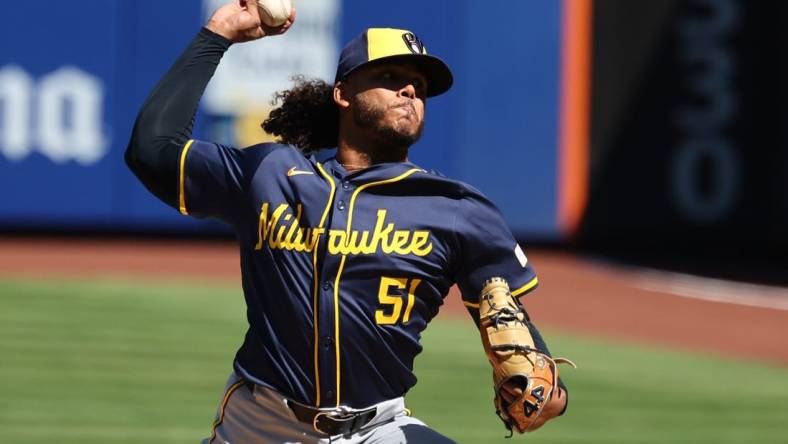 Mar 29, 2024; New York City, New York, USA; Milwaukee Brewers starting pitcher Freddy Peralta (51) delivers a pitch  during the first inning against the New York Mets at Citi Field. Mandatory Credit: Vincent Carchietta-USA TODAY Sports