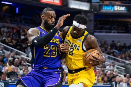 Mar 29, 2024; Indianapolis, Indiana, USA; Indiana Pacers forward Pascal Siakam (43) shoots the ball while Los Angeles Lakers forward LeBron James (23) defends in the first half at Gainbridge Fieldhouse. Mandatory Credit: Trevor Ruszkowski-USA TODAY Sports