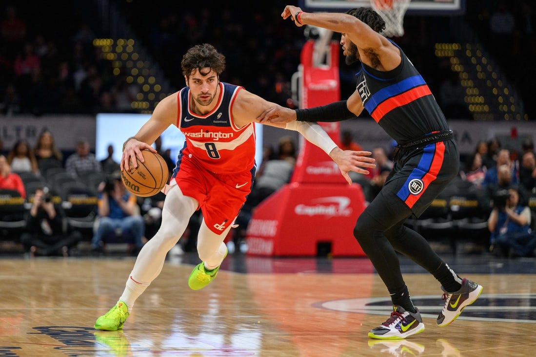 Mar 29, 2024; Washington, District of Columbia, USA; Washington Wizards forward Deni Avdija (8) drives to the basket against Detroit Pistons forward Troy Brown Jr. (7) at Capital One Arena. Mandatory Credit: Reggie Hildred-USA TODAY Sports