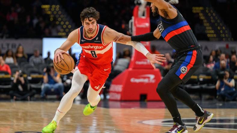 Mar 29, 2024; Washington, District of Columbia, USA; Washington Wizards forward Deni Avdija (8) drives to the basket against Detroit Pistons forward Troy Brown Jr. (7) at Capital One Arena. Mandatory Credit: Reggie Hildred-USA TODAY Sports