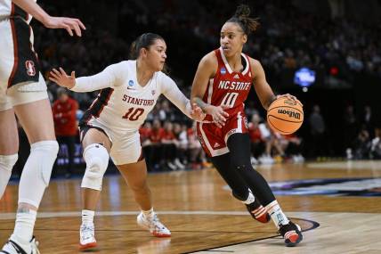 Mar 29, 2024; Portland, OR, USA; NC State Wolfpack guard Aziaha James (10) drives to the basket during the first half against Stanford Cardinal guard Talana Lepolo (10) in the semifinals of the Portland Regional of the 2024 NCAA Tournament at the Moda Center at the Moda Center. Mandatory Credit: Troy Wayrynen-USA TODAY Sports