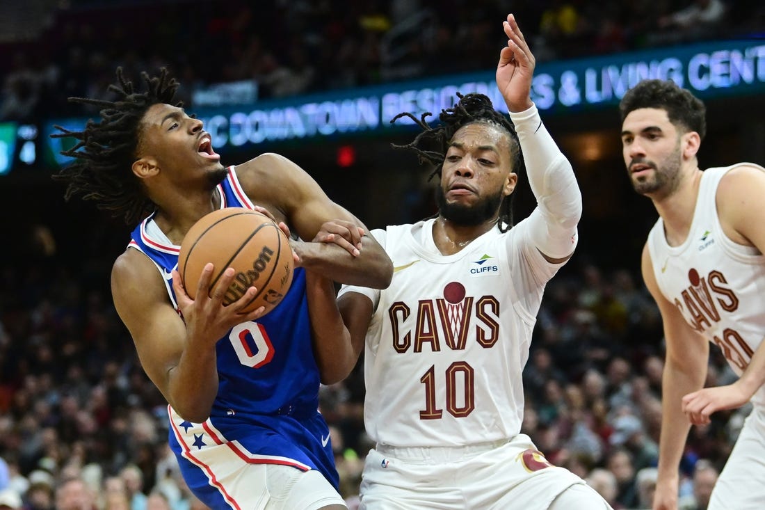 Mar 29, 2024; Cleveland, Ohio, USA; Philadelphia 76ers guard Tyrese Maxey (0) drives to the basket against Cleveland Cavaliers guard Darius Garland (10) during the first half at Rocket Mortgage FieldHouse. Mandatory Credit: Ken Blaze-USA TODAY Sports