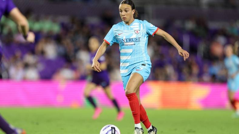 Mar 29, 2024; Orlando, Florida, USA; Chicago Red Stars forward Mallory Swanson (9) dribbles the ball during the second half against the Orlando Pride at Inter&Co Stadium. Mandatory Credit: Nathan Ray Seebeck-USA TODAY Sports