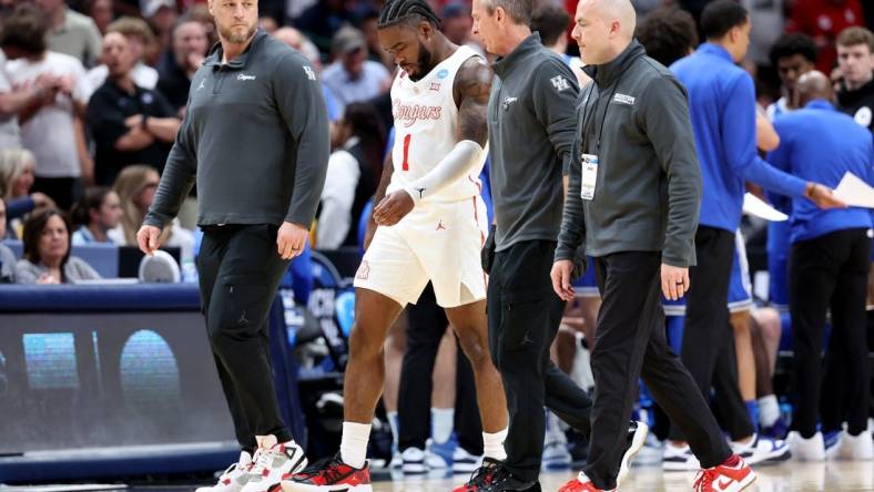 Mar 29, 2024; Dallas, TX, USA; Houston Cougars guard Jamal Shead (1) walks off the floor after an injury during the first half in the semifinals of the South Regional of the 2024 NCAA Tournament against the Duke Blue Devils at American Airlines Center. Mandatory Credit: Kevin Jairaj-USA TODAY Sports