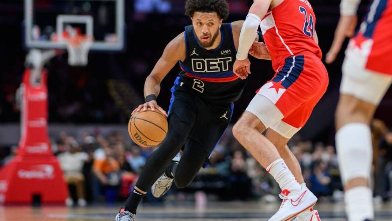 Mar 29, 2024; Washington, District of Columbia, USA; Detroit Pistons guard Cade Cunningham (2) drives to the basket against Washington Wizards forward Corey Kispert (24) during the third quarter at Capital One Arena. Mandatory Credit: Reggie Hildred-USA TODAY Sports