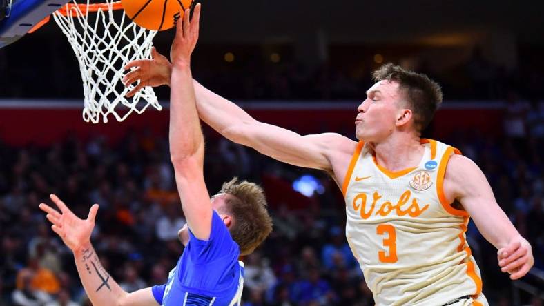 Tennessee guard Dalton Knecht (3) blocks Creighton guard Baylor Scheierman (55) during a NCAA Tournament Sweet 16 game between Tennessee and Creighton held at Little Caesars Arena in Detroit on Friday, March 29, 2024.