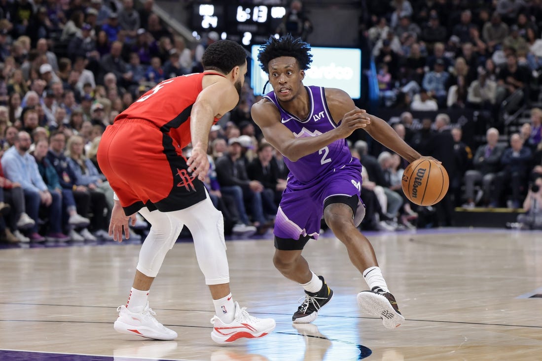 Mar 29, 2024; Salt Lake City, Utah, USA;  Utah Jazz guard Collin Sexton (2) tries to dribble past Houston Rockets guard Fred VanVleet (5) during the second quarter at Delta Center. Mandatory Credit: Chris Nicoll-USA TODAY Sports