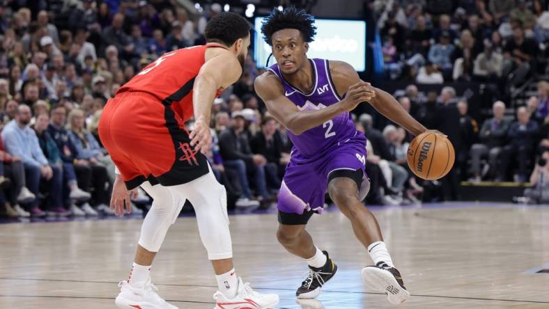 Mar 29, 2024; Salt Lake City, Utah, USA;  Utah Jazz guard Collin Sexton (2) tries to dribble past Houston Rockets guard Fred VanVleet (5) during the second quarter at Delta Center. Mandatory Credit: Chris Nicoll-USA TODAY Sports