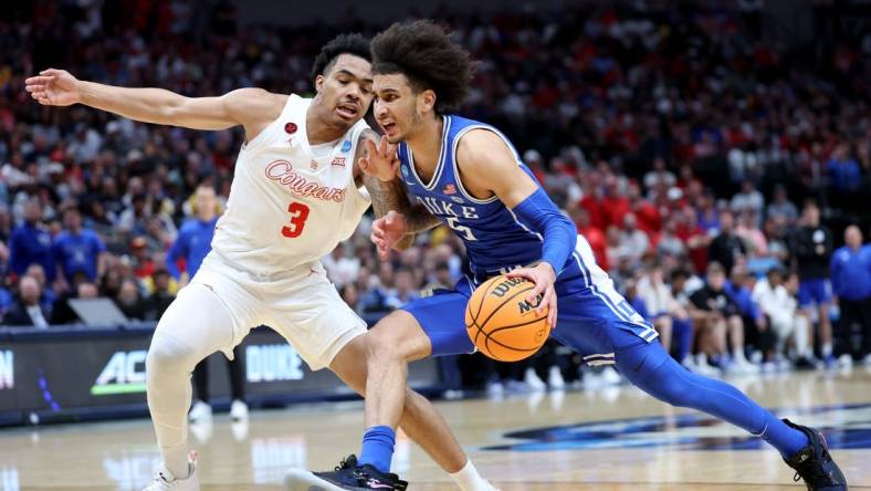 Mar 29, 2024; Dallas, TX, USA; Duke Blue Devils guard Tyrese Proctor (5) drives against Houston Cougars guard Ramon Walker Jr. (3) during the first half in the semifinals of the South Regional of the 2024 NCAA Tournament at American Airlines Center. Mandatory Credit: Kevin Jairaj-USA TODAY Sports