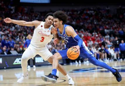 Mar 29, 2024; Dallas, TX, USA; Duke Blue Devils guard Tyrese Proctor (5) drives against Houston Cougars guard Ramon Walker Jr. (3) during the first half in the semifinals of the South Regional of the 2024 NCAA Tournament at American Airlines Center. Mandatory Credit: Kevin Jairaj-USA TODAY Sports
