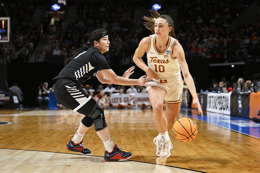Mar 29, 2024; Portland, OR, USA; Texas Longhorns guard Shay Holle (10) dribbles the basketball during the first half against Gonzaga Bulldogs guard Kaylynne Truong (14) in the semifinals of the Portland Regional of the 2024 NCAA Tournament at the Moda Center at the Moda Center. Mandatory Credit: Troy Wayrynen-USA TODAY Sports
