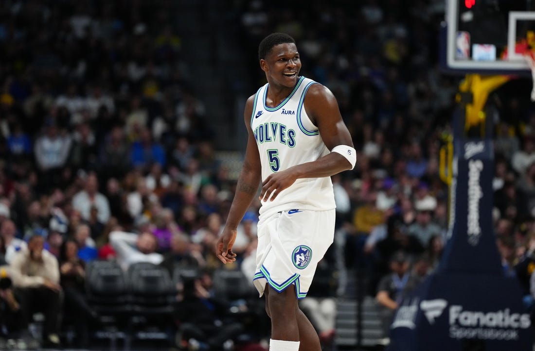 Mar 29, 2024; Denver, Colorado, USA; Minnesota Timberwolves guard Anthony Edwards (5) reacts in the second half against the Denver Nuggets at Ball Arena. Mandatory Credit: Ron Chenoy-USA TODAY Sports