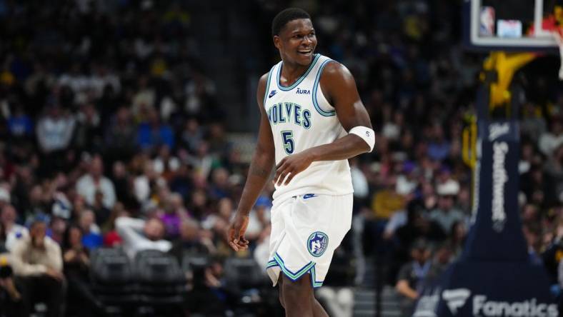 Mar 29, 2024; Denver, Colorado, USA; Minnesota Timberwolves guard Anthony Edwards (5) reacts in the second half against the Denver Nuggets at Ball Arena. Mandatory Credit: Ron Chenoy-USA TODAY Sports