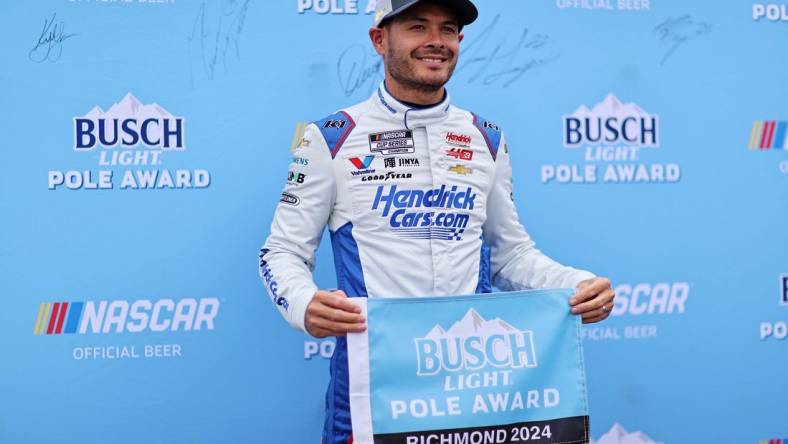 Mar 30, 2024; Richmond, Virginia, USA; NASCAR Cup Series driver Kyle Larson (5) celebrates within the pole after qualifying for the Toyota Owners 400 at Richmond Raceway. Mandatory Credit: Peter Casey-USA TODAY Sports