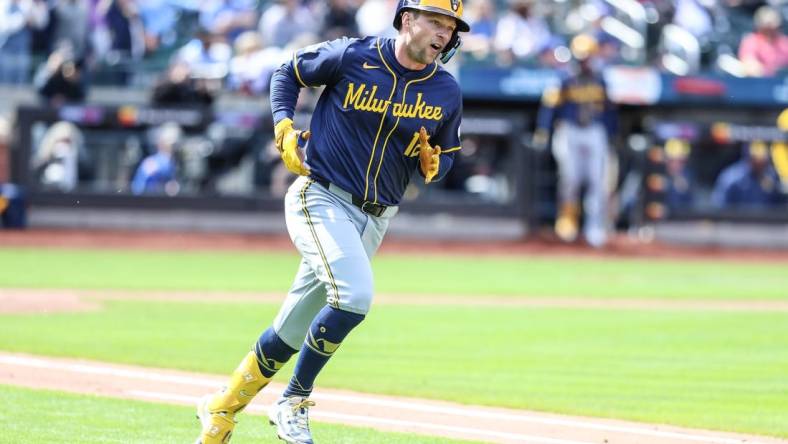 Mar 30, 2024; New York City, New York, USA;  Milwaukee Brewers designated hitter Rhys Hoskins (12) reacts after hitting a two-run home run in the third inning New York Mets at Citi Field. Mandatory Credit: Wendell Cruz-USA TODAY Sports