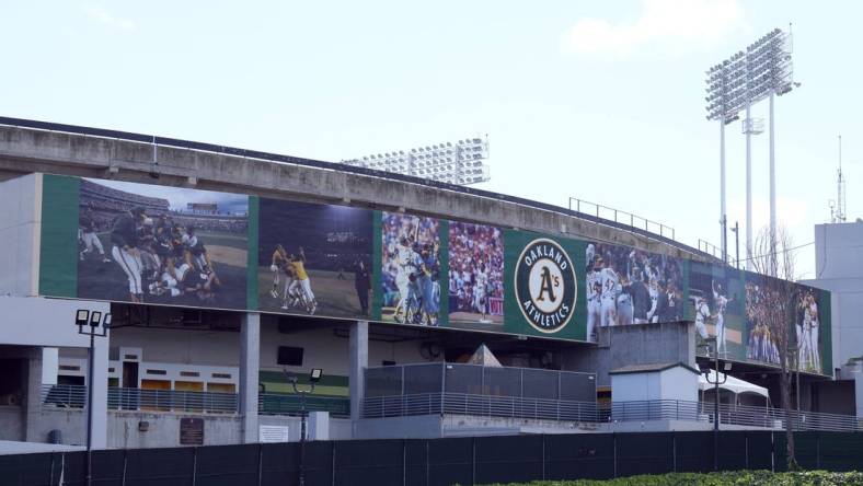 Mar 30, 2024; Oakland, California, USA; A mural on the outside of the stadium that replaced the Rooted in Oakland sign as seen before the game between the Oakland Athletics and the Cleveland Guardians at Oakland-Alameda County Coliseum. Mandatory Credit: Darren Yamashita-USA TODAY Sports