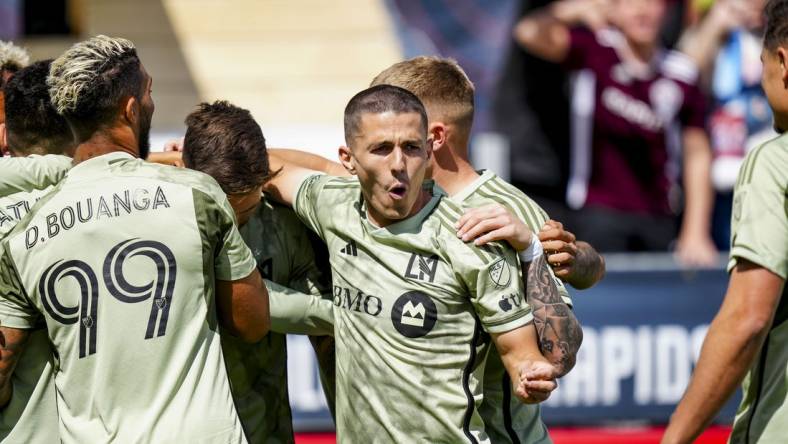 Mar 30, 2024; Commerce City, Colorado, USA; LAFC midfielder Eduard Atuesta (20) celebrates scoring a goal during the first half at Dick's Sporting Goods Park. Mandatory Credit: Ron Chenoy-USA TODAY Sports