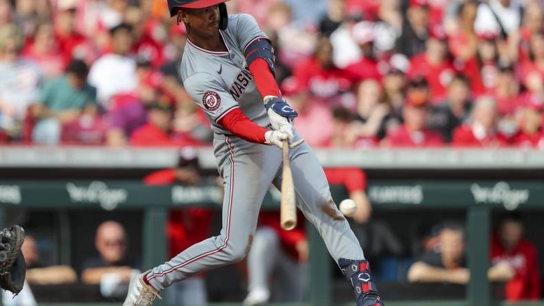 Mar 30, 2024; Cincinnati, Ohio, USA; Washington Nationals third baseman Trey Lipscomb (38) hits a single against the Cincinnati Reds in the third inning at Great American Ball Park. Mandatory Credit: Katie Stratman-USA TODAY Sports