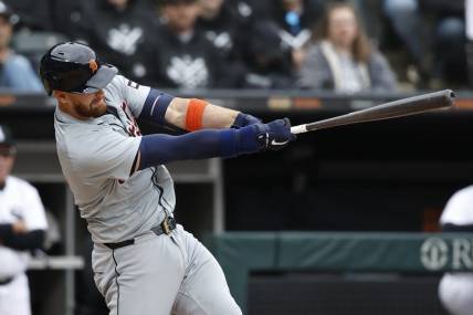 Mar 30, 2024; Chicago, Illinois, USA; Detroit Tigers catcher Carson Kelly (15) hits an RBI-single against the Chicago White Sox during the 10th inning at Guaranteed Rate Field. Mandatory Credit: Kamil Krzaczynski-USA TODAY Sports