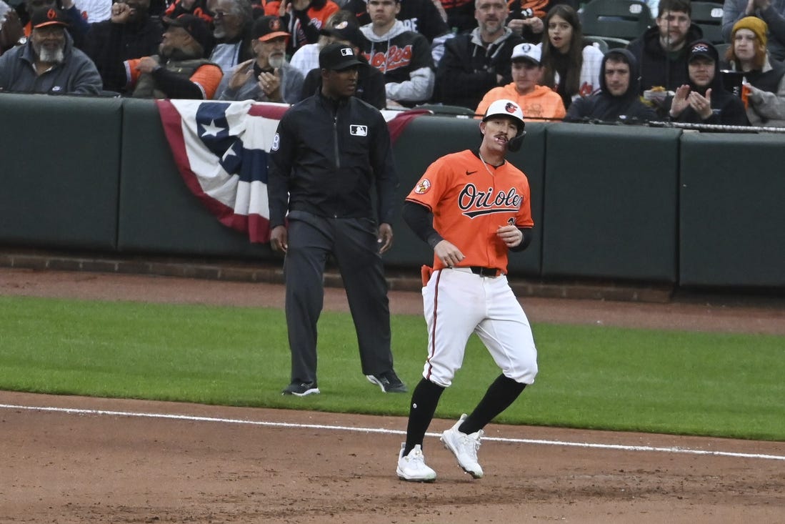 Mar 30, 2024; Baltimore, Maryland, USA; ]Baltimore Orioles left fielder Austin Hays (21) reacts after hitting a sixth inning  rbi single against the Los Angeles Angels  at Oriole Park at Camden Yards. Mandatory Credit: Tommy Gilligan-USA TODAY Sports