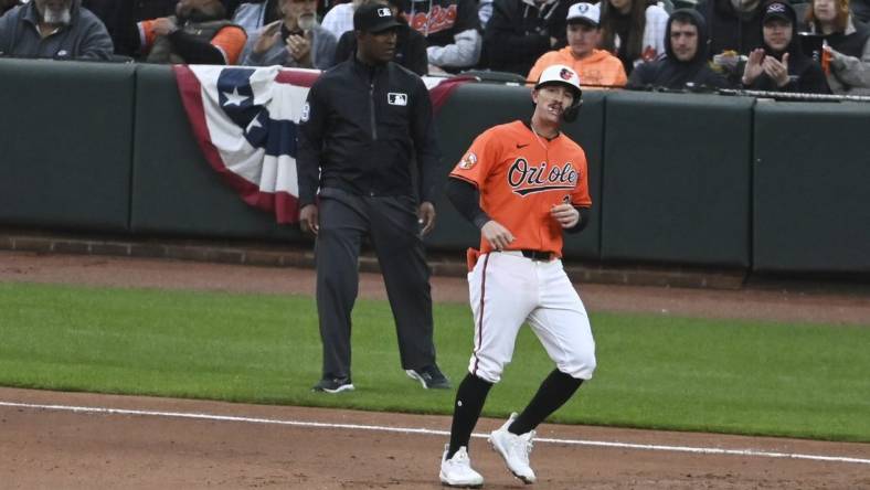 Mar 30, 2024; Baltimore, Maryland, USA; ]Baltimore Orioles left fielder Austin Hays (21) reacts after hitting a sixth inning  rbi single against the Los Angeles Angels  at Oriole Park at Camden Yards. Mandatory Credit: Tommy Gilligan-USA TODAY Sports