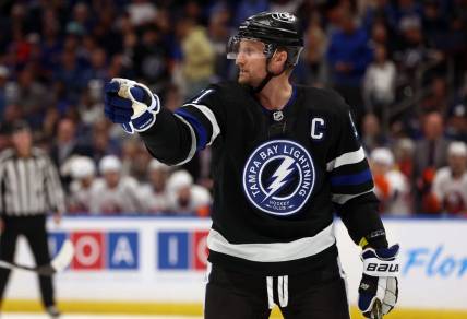 Mar 30, 2024; Tampa, Florida, USA; Tampa Bay Lightning center Steven Stamkos (91) points against the New York Islanders during the first period at Amalie Arena. Mandatory Credit: Kim Klement Neitzel-USA TODAY Sports