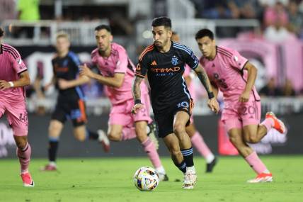 Mar 30, 2024; Fort Lauderdale, Florida, USA; New York City FC forward Santiago Rodriguez (10) dribbles against Inter Miami CF during the first half at Chase Stadium. Mandatory Credit: Nathan Ray Seebeck-USA TODAY Sports