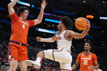 Mar 30, 2024; Los Angeles, CA, USA;  Alabama Crimson Tide guard Mark Sears (1) controls the ball against Clemson Tigers forward Ian Schieffelin (4) in the first half in the finals of the West Regional of the 2024 NCAA Tournament at Crypto.com Arena. Mandatory Credit: Kirby Lee-USA TODAY Sports