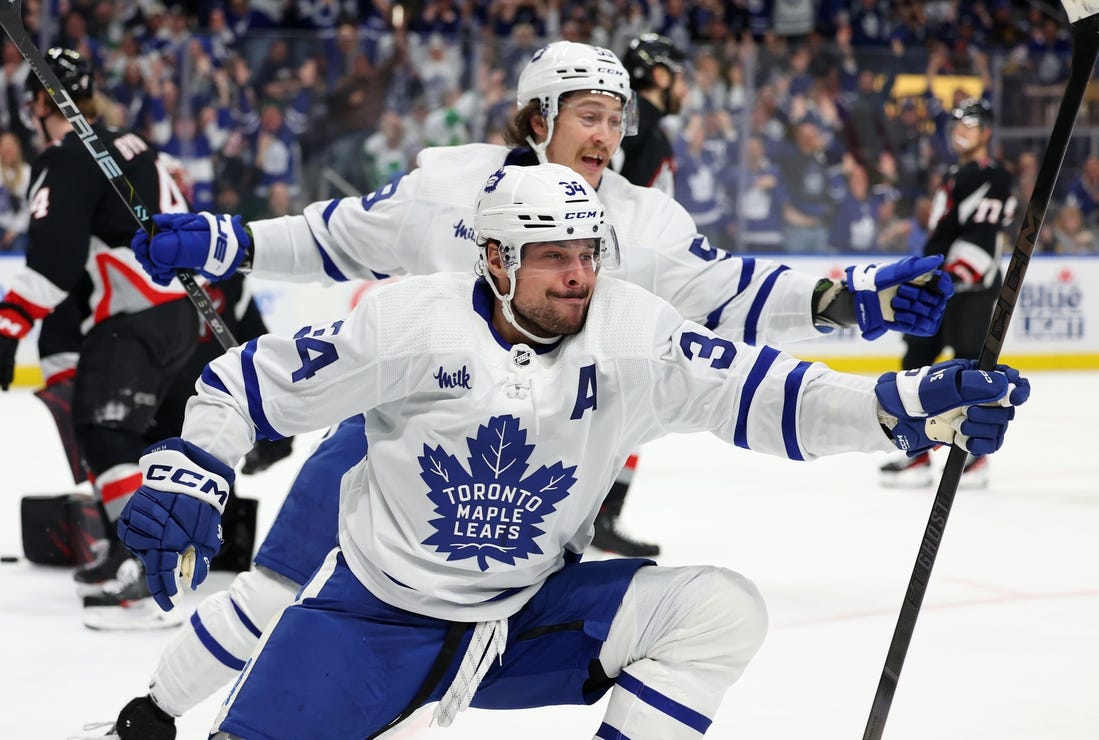 Mar 30, 2024; Buffalo, New York, USA;  Toronto Maple Leafs center Auston Matthews (34) reacts after scoring his 60th goal of the year during the third period against the Buffalo Sabres at KeyBank Center. Mandatory Credit: Timothy T. Ludwig-USA TODAY Sports