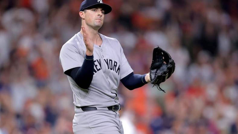 Mar 30, 2024; Houston, Texas, USA; New York Yankees relief pitcher Clay Holmes (35) reacts after the final out against the Houston Astros during the ninth inning at Minute Maid Park. Mandatory Credit: Erik Williams-USA TODAY Sports