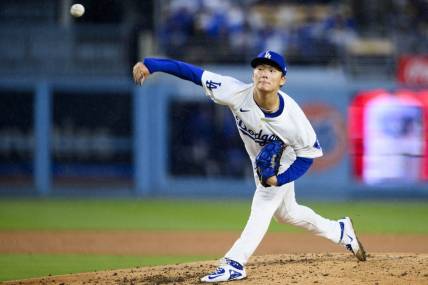 Mar 30, 2024; Los Angeles, California, USA; Los Angeles Dodgers starting pitcher Yoshinobu Yamamoto (18) throws out a pitch during the fourth inning against the St. Louis Cardinals at Dodger Stadium. Mandatory Credit: Kelvin Kuo-USA TODAY Sports